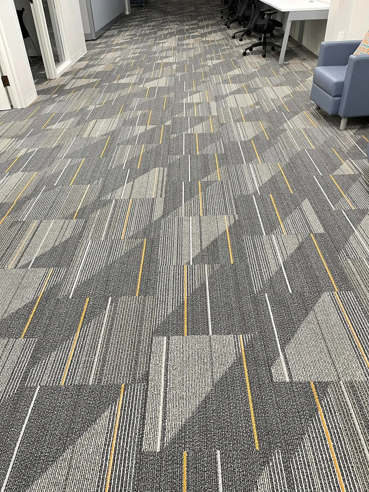 Geometric commercial carpet tile installation